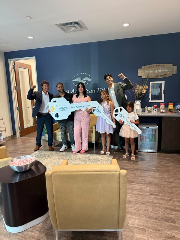 Happy family celebrating their closing day